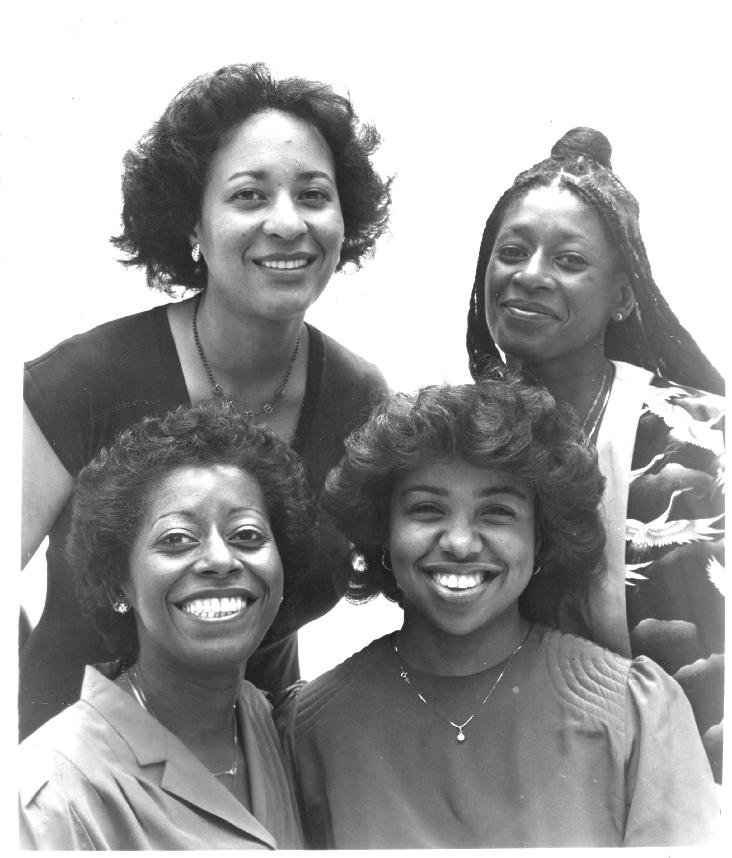 Uptown String Quartet, 1983.  Pictured (clockwise from left): Maxine Roach (viola), Akua Dixon (cello), Cecelia Hobbs (violin 2), Gayle Dixon (violin 1).  Photo by Chuck Stewart.  Publicity shot taken for first European tour of the Max Roach Double Quartet/ Uptown String Quartet, which included 28 critically-acclaimed performances in eight countries:  Austria, Switzerland, Italy, Germany, Noway, Finland, Denmark, and Spain.